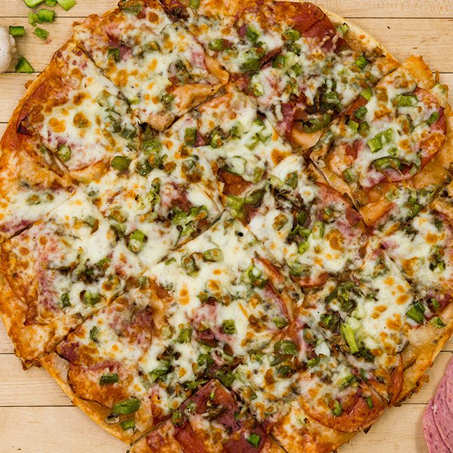 Roccos-Pizzeria-Img-04 Finely crafted pizza for sports team fundraising, ready for delivery.